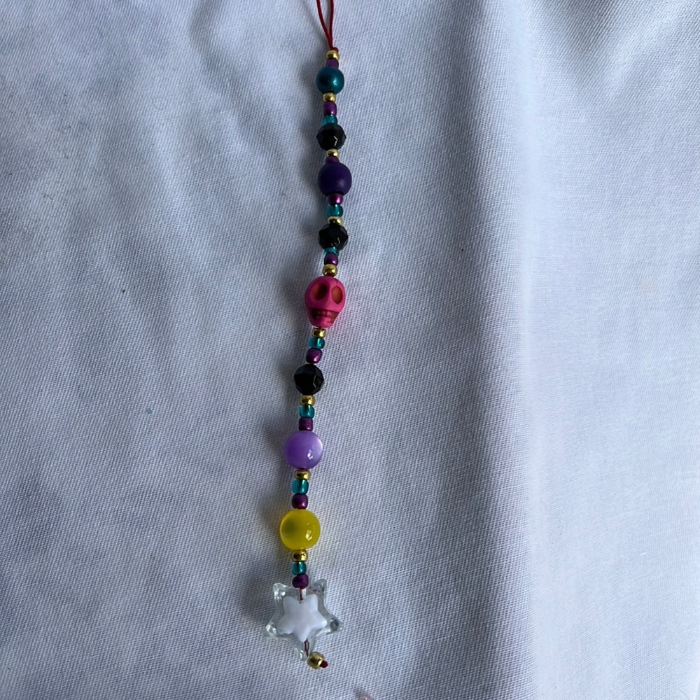 Skull multi color phone charm